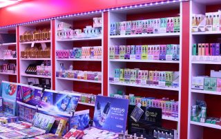 Vape shop shelf and counter top display with colorful vapes