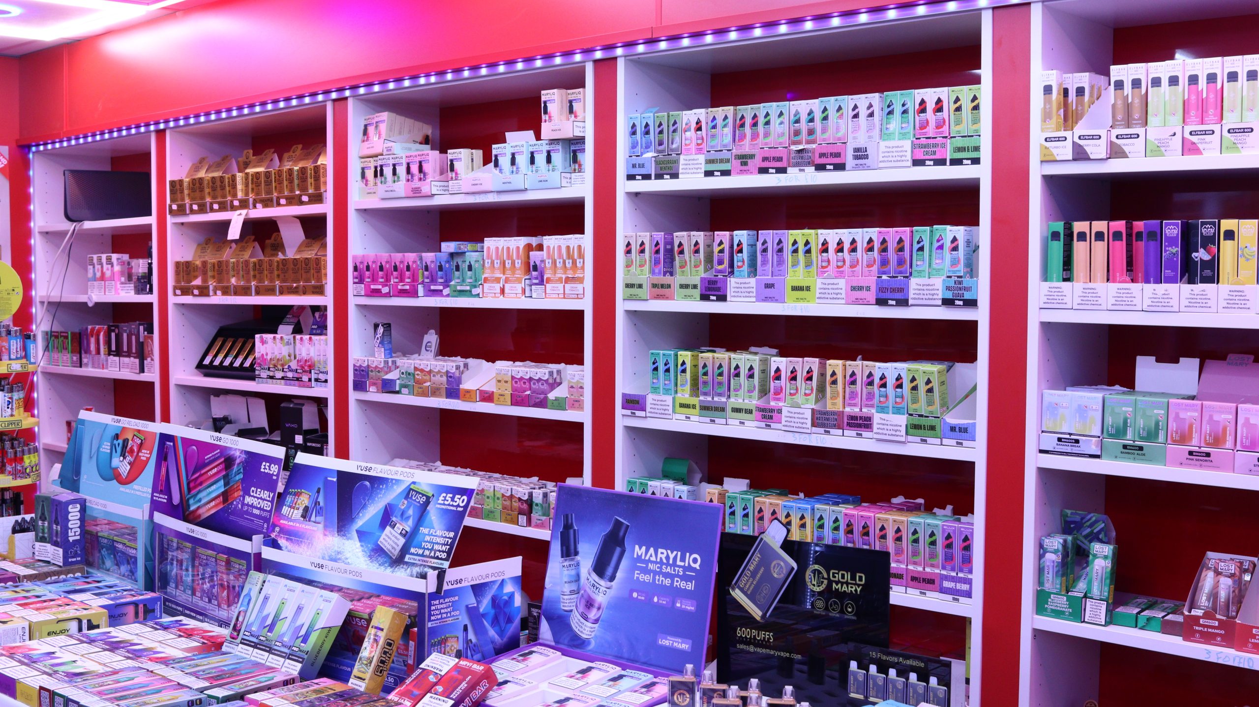 Vape shop shelf and counter top display with colorful vapes